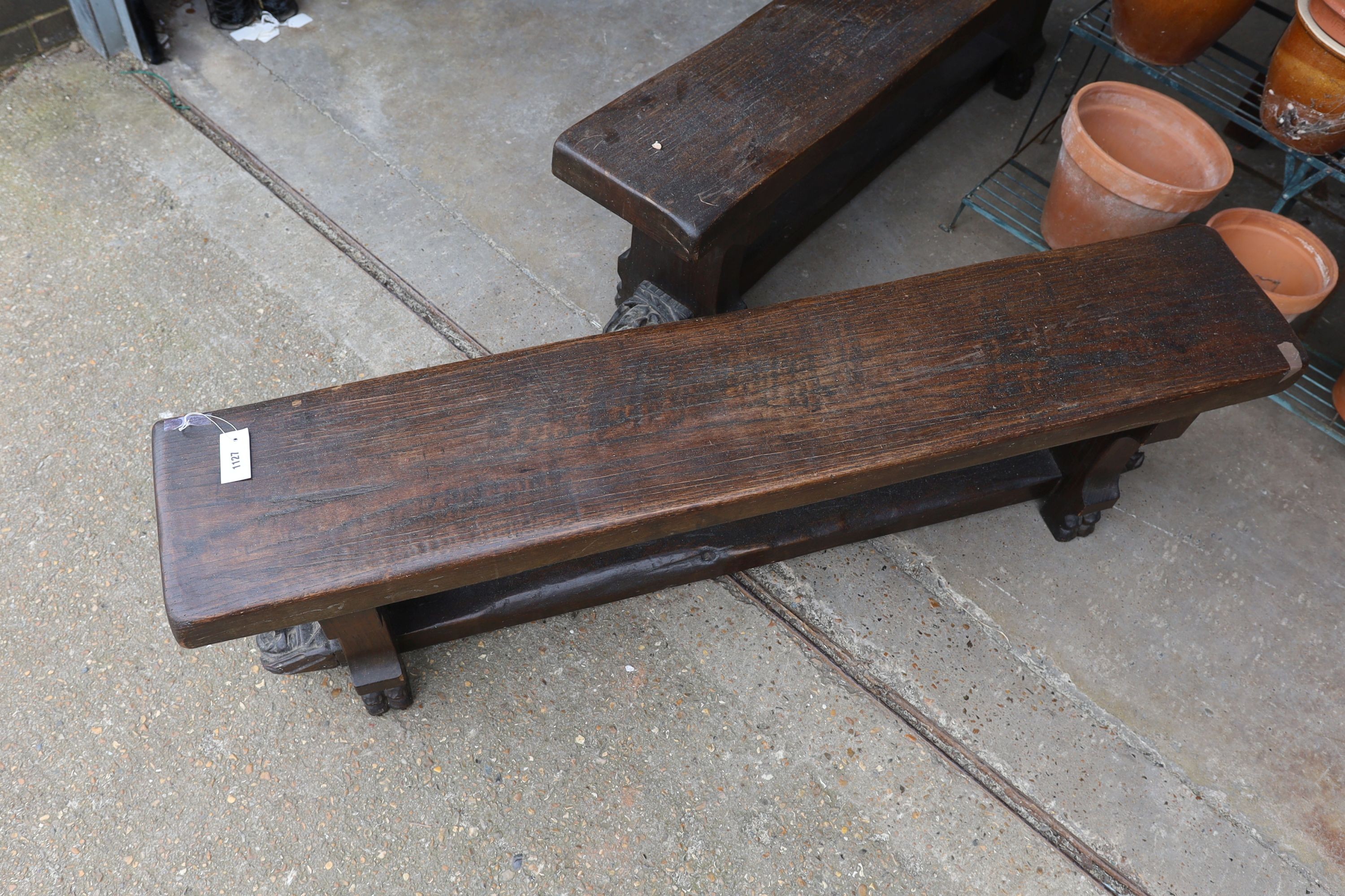 A pair of 17th century style carved oak New England benches, length 150cm, depth 28cm, height 46cm